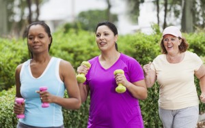 Women exercising in park